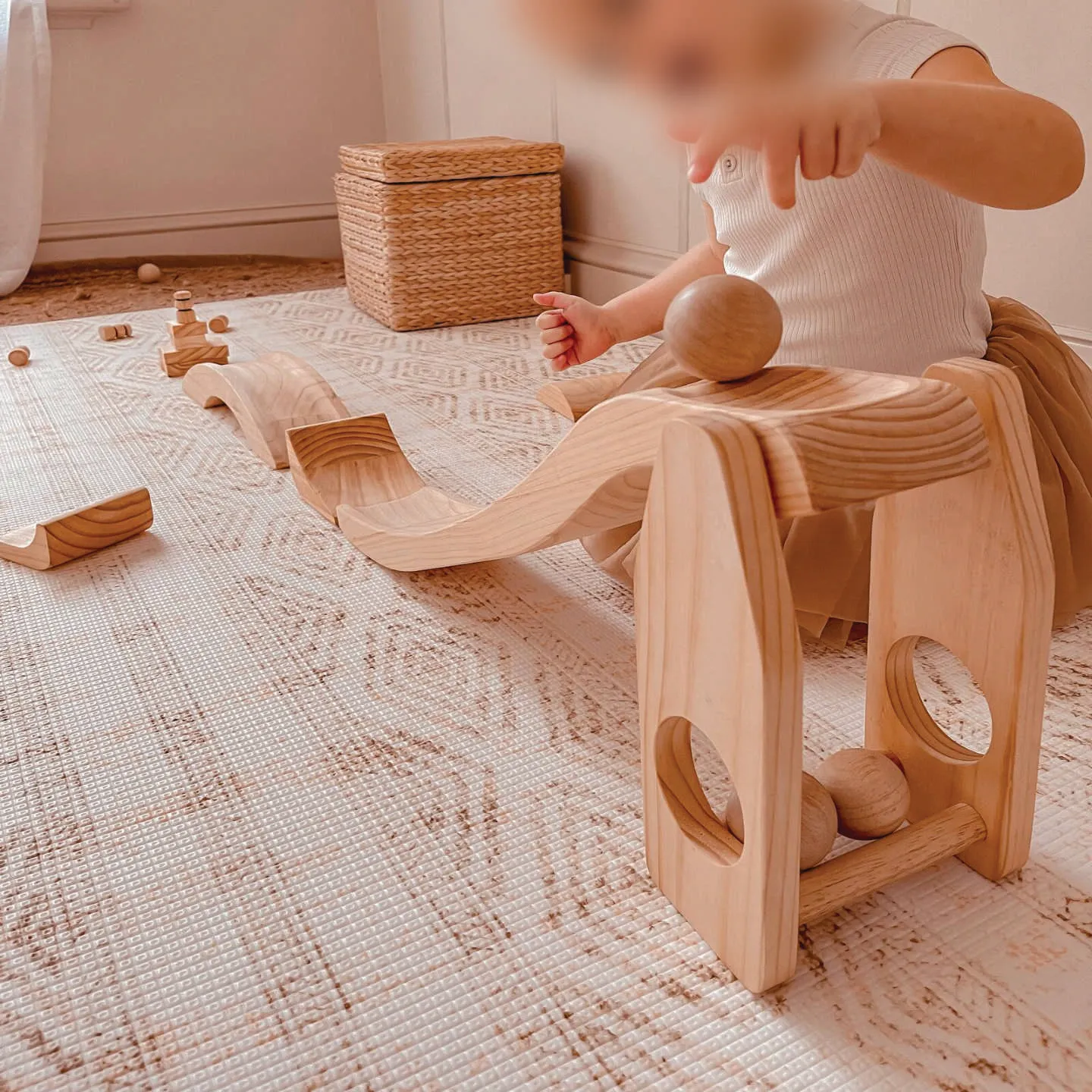 A kid playing with a montessori toy